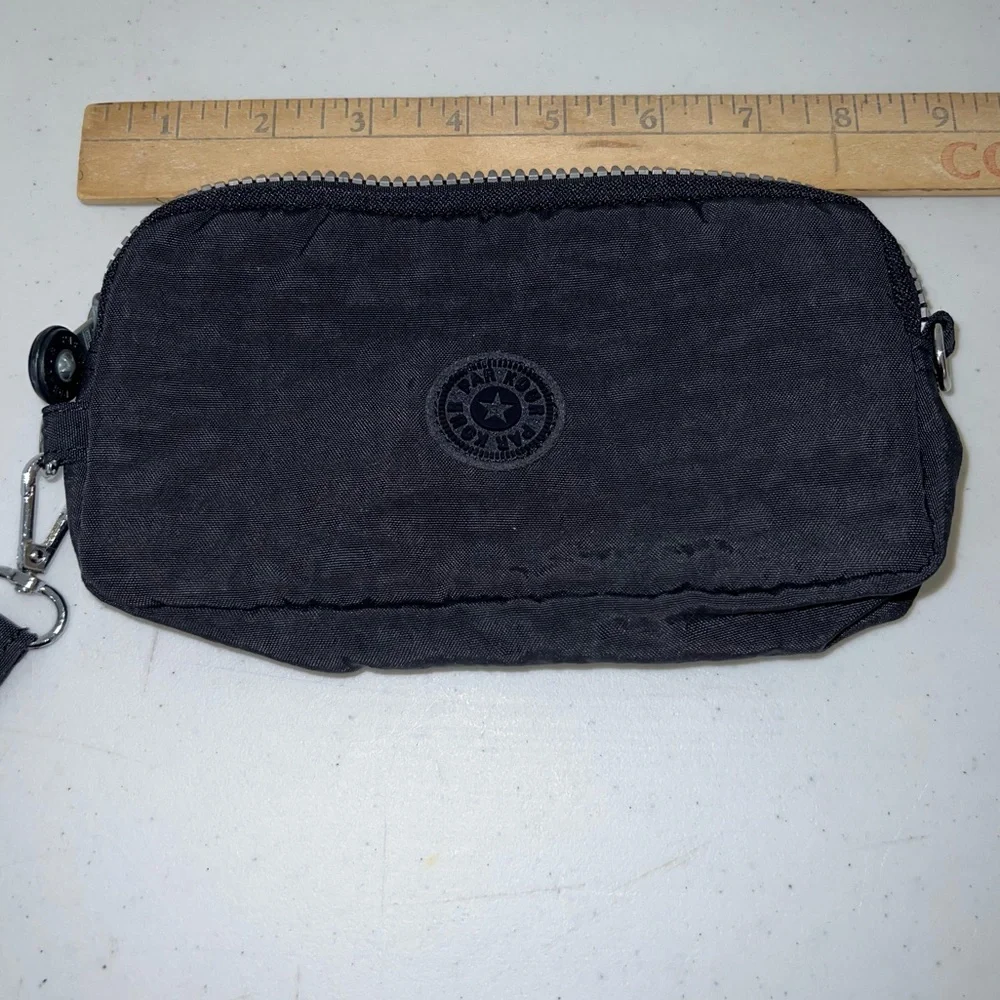 Par Kour black wristlet wallet. RFID technology, zipper with strap